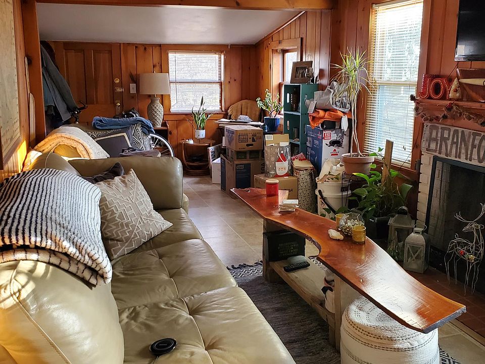 Beautiful real hardwood paneling on living room walls.