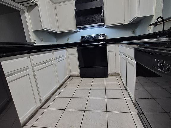 kitchen with side-by-side Samsung fridge, newish dishwasher, new disposal, overhead microwave