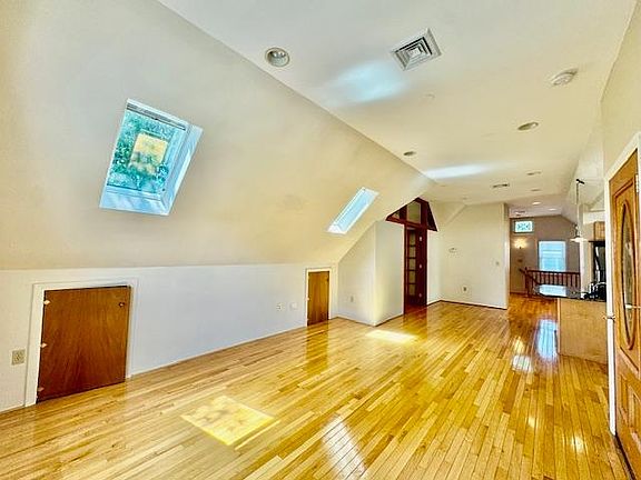 Spacious loft space! This is the living room area looking back into the kitchen area.