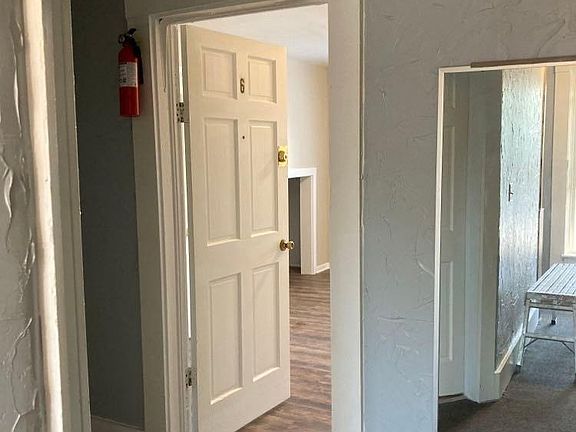 Entryway from upstairs hallway into unit # 6 (the shared bathroom is on the right in this photo). That's a full length mirror on the right.