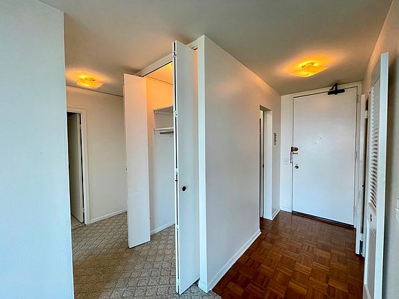 Entry with beautiful Parque floors as you walk int