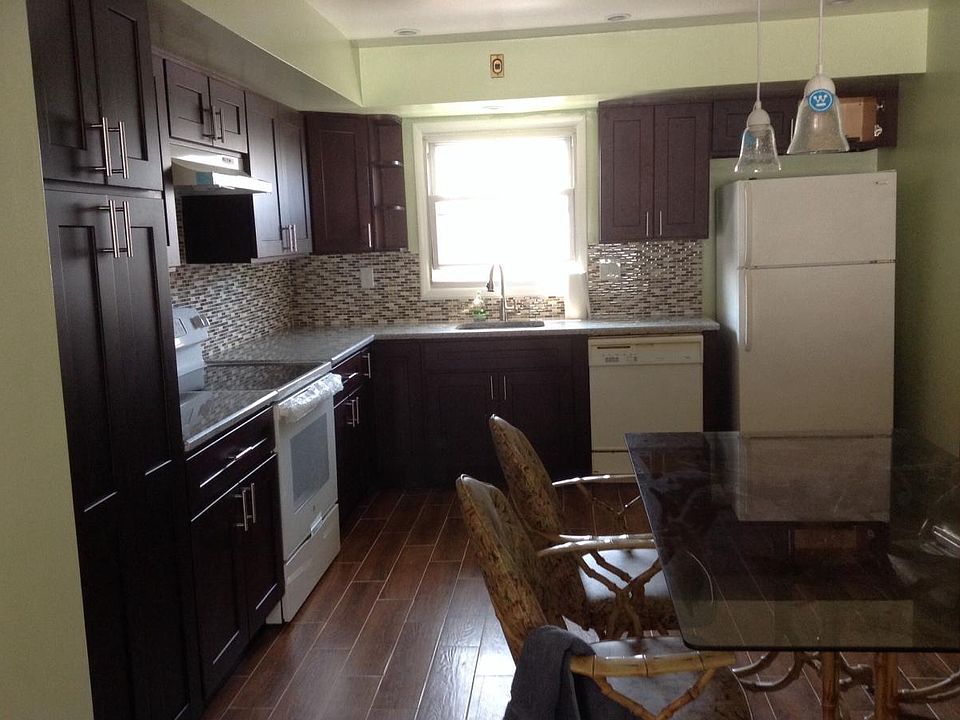Kitchen with granite countertop, lots of storage cabinets
