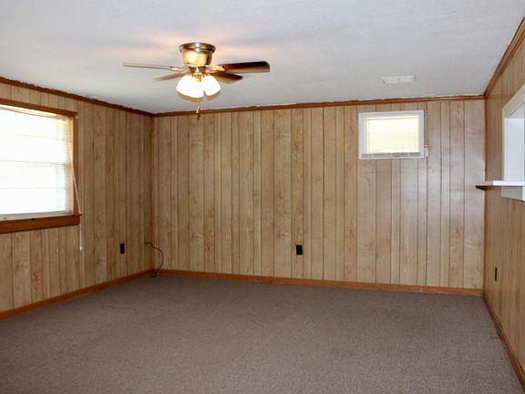 Living Room with Wood Panel Walls