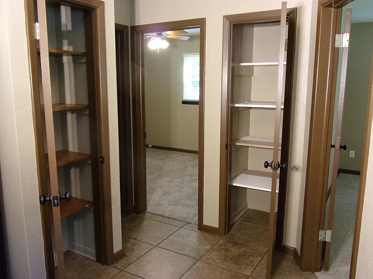 HALL STORAGE CLOSETS - MANY DEEP SHELVES