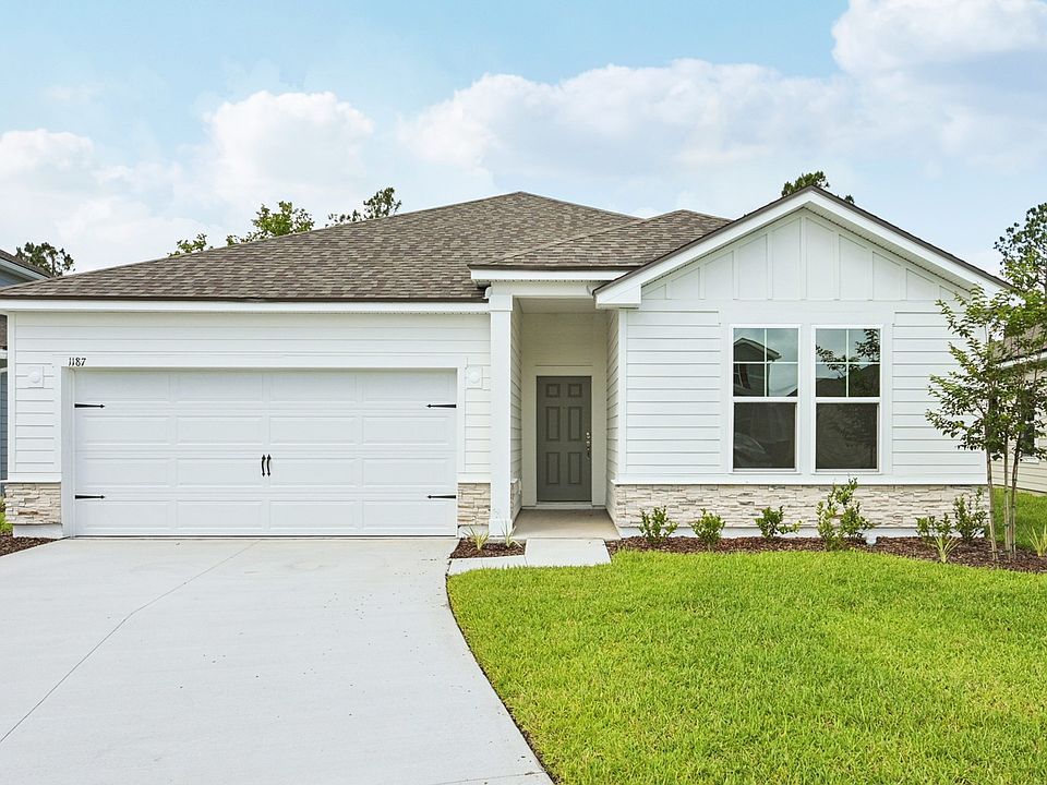 Elegant ranch-style home featuring refined stonework and pristine siding in desirable Panther Creek