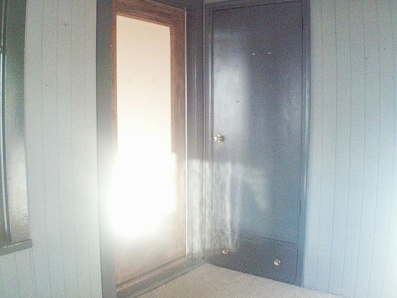 Large front enclosed entry porch with closet for all your ge