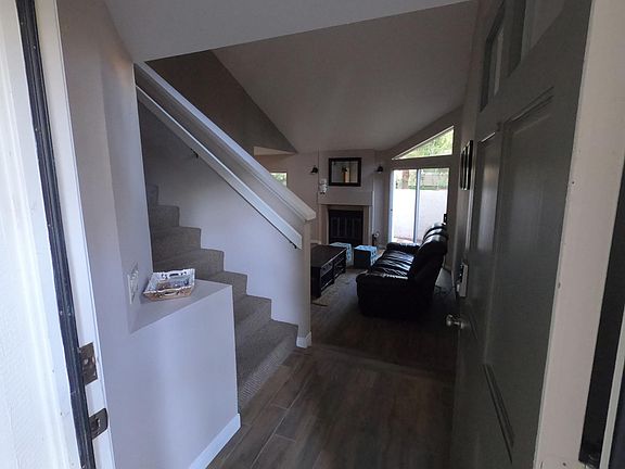 Entryway, stairs, and living room.