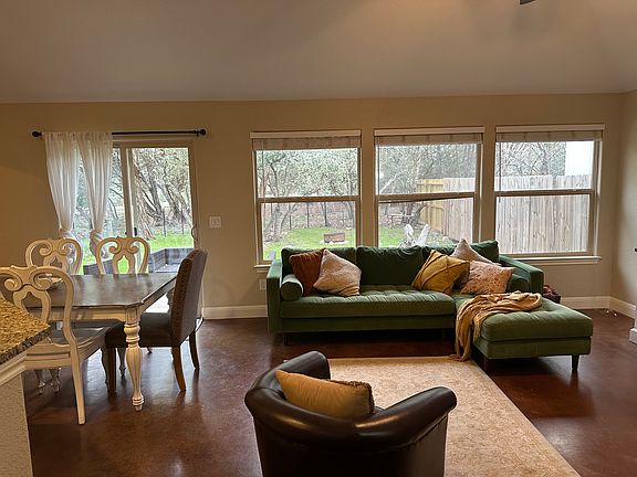 Living dining area looking to back yard. The house backs to a greenbelt.