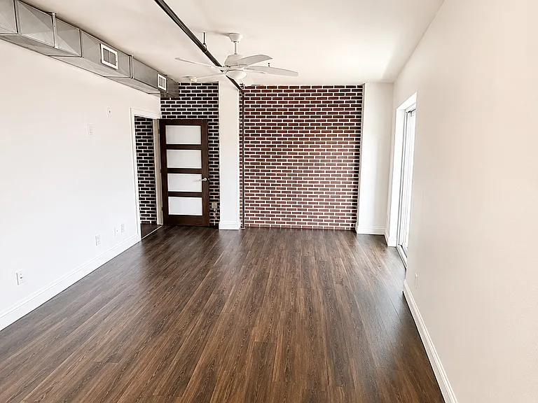 Additional view of the primary suite with generous floor space.