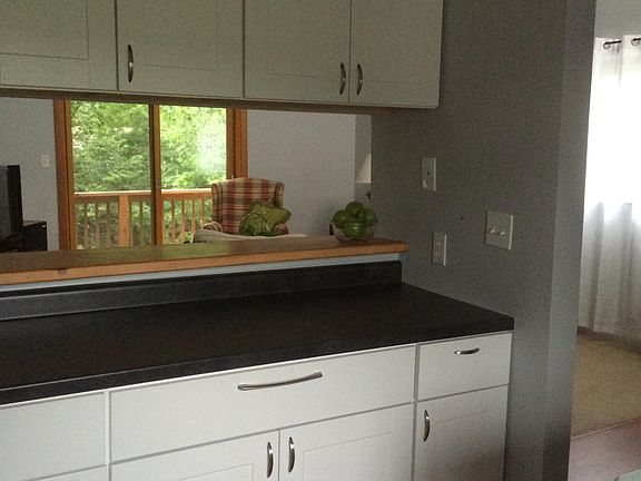 more kitchen pics showing ample counter top space and pass through to living room