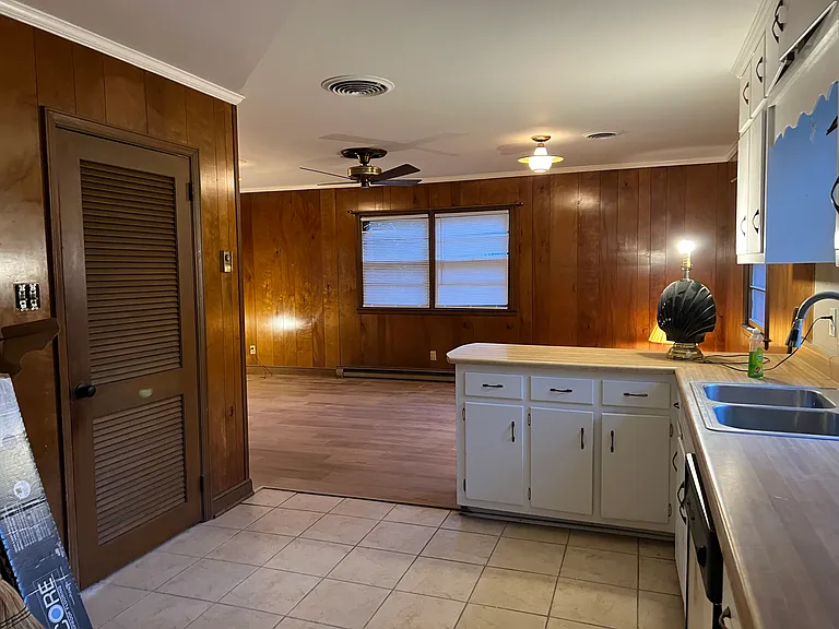 Kitchen and many, many cabinets. 
All freshly painted. Large pantry with with new Luxury Vinyl Plank. Shelving being added to large walk-in pantry.