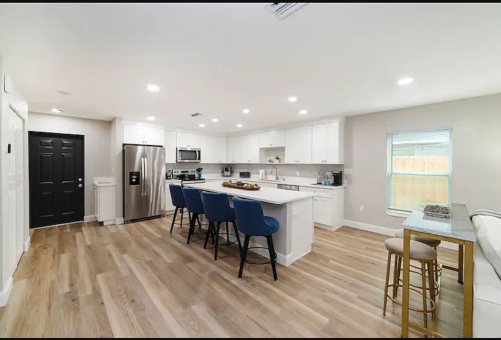 The open floor plan of the kitchen and living area allow your group to gather for meals or conversation.
