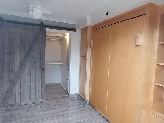 Comfortable Queen size Murphy Bed and walk in closet with co