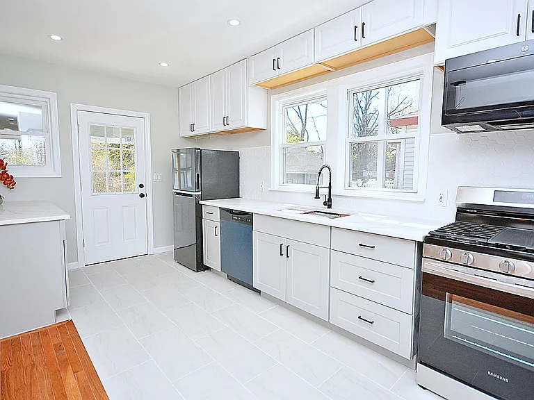 Kitchen - extra cabinets and counter space to the left. Perfect spot for coffee bar or air fryer.