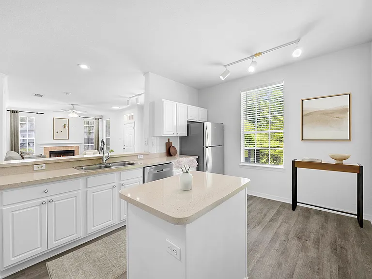 Open kitchen with center island, stainless appliances for hosting dinner
