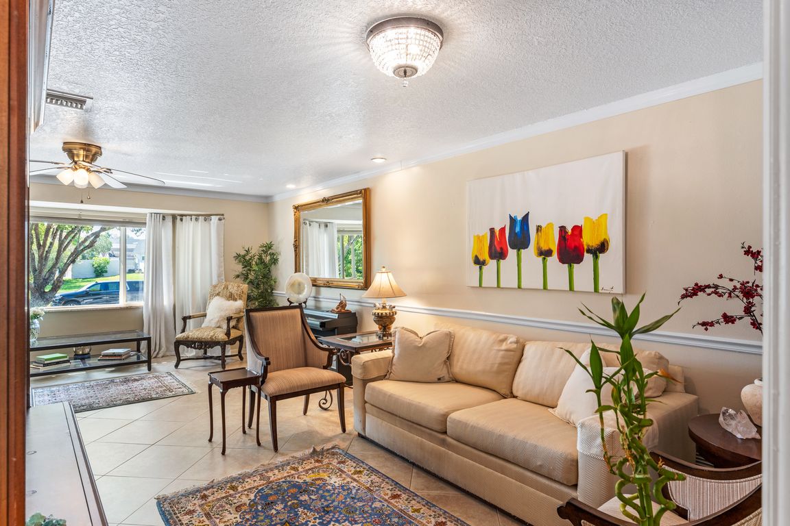 L-shaped formal living creates multiple seating areas to entertain and relax.
