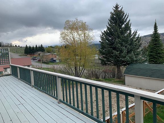 view of shed and parking