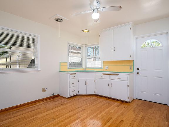 Spacious and bright kitchen with door to the driveway