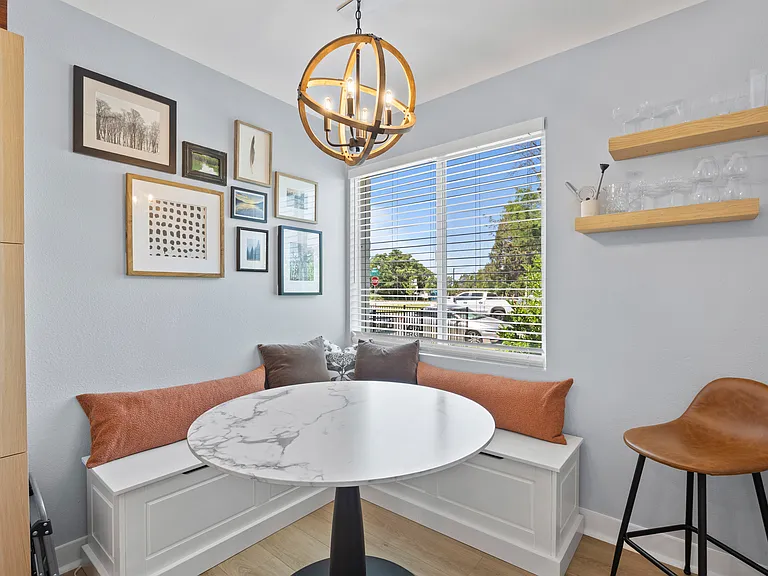 Dining nook and laptop-friendly workspace with a storage bench.