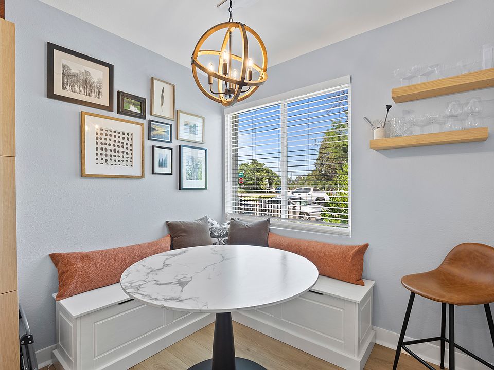 Dining nook and laptop-friendly workspace with a storage bench.