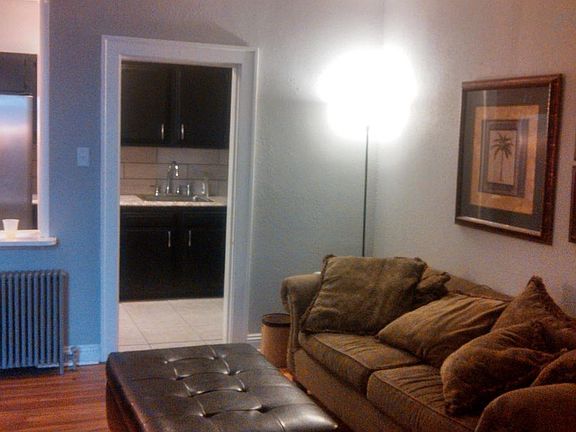 Living room with Plasma TV mount and Hardwood Floors