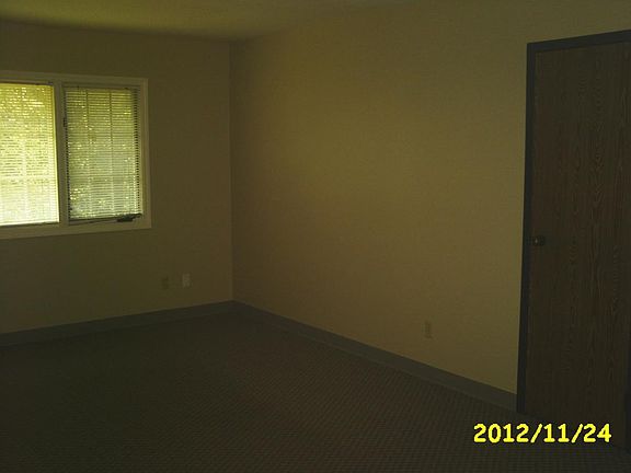 Living room from kitchen, door is to HVAC
