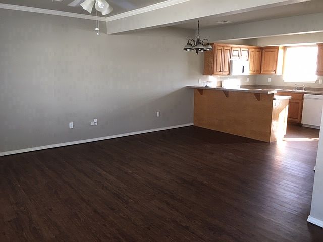 Living room and dining area with breakfast bar