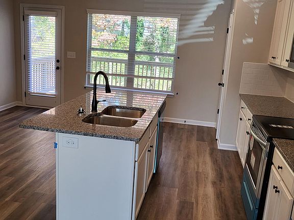 Kitchen with Frigidaire Oven/Stove, Microwave, Dishwasher, Refrigerator and Garbage Disposal