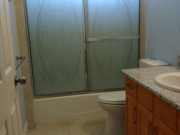 Clean bathroom. Shower tub combo.