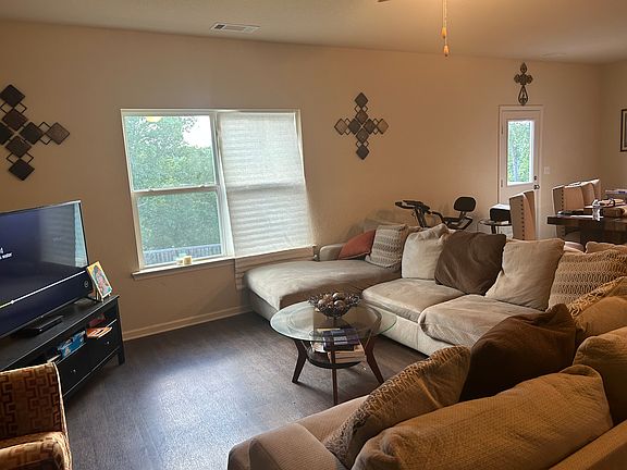 Captures space of living room and dining area. Come tour the space to see it for yourself!