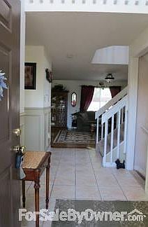 Entry way
						:
						Entry way to main floor with bathroom, living room, dining room and kitchen