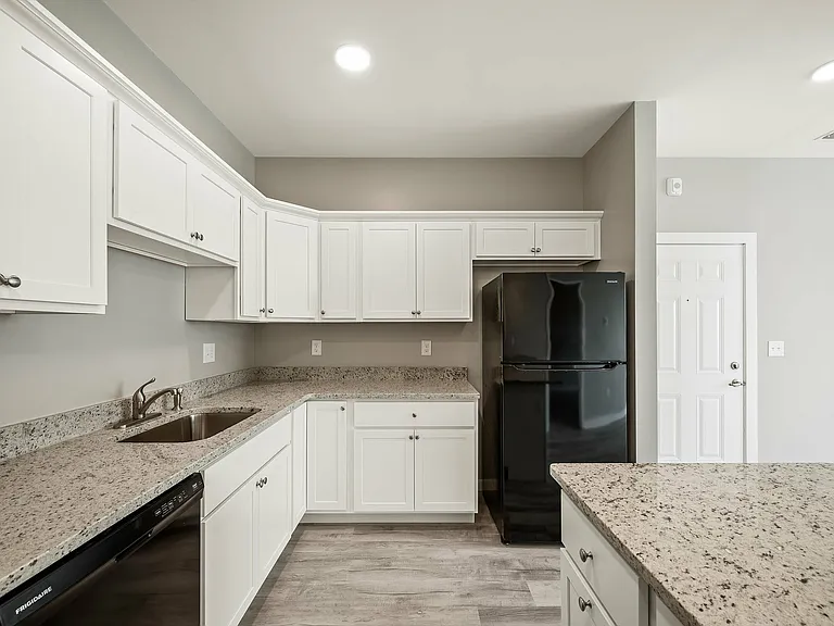 Experience culinary delight in this sleek, modern kitchen, designed for both style and function.