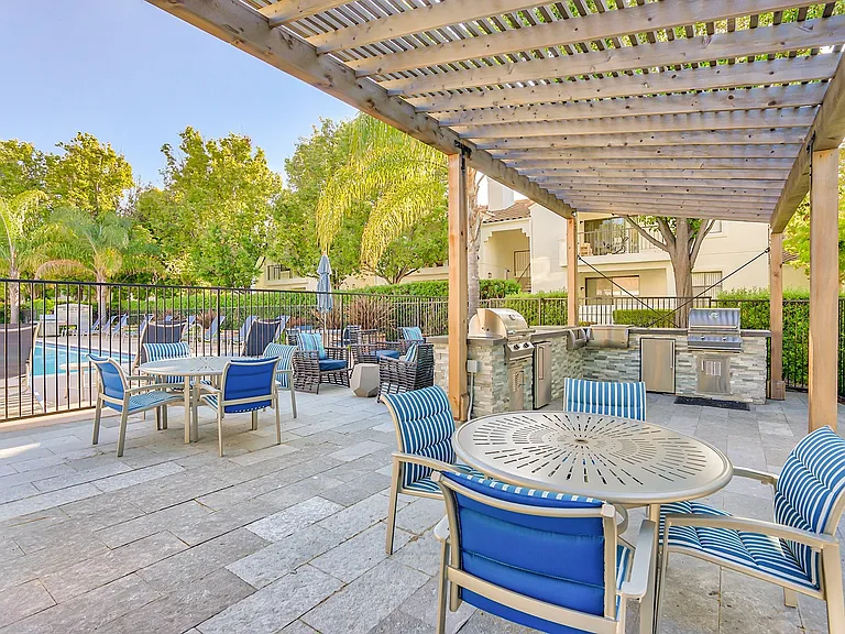 BBQ and lounge area near the pool