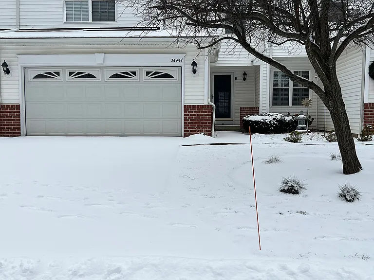 Front view with 2-car, heated, attached garage.