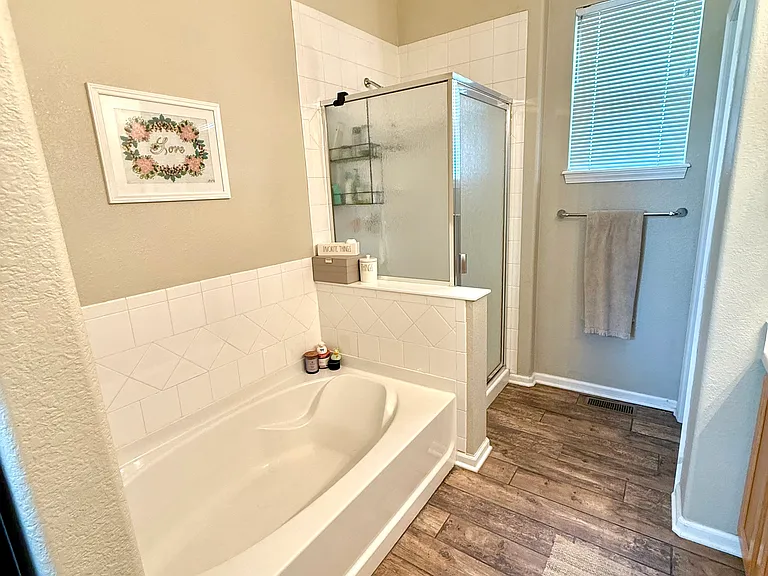 Primary bath - full size garden tub and stand alone shower