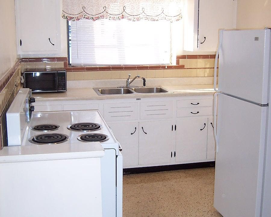 Equipped with stove, microwave, 8-foot counter top and refrigerator