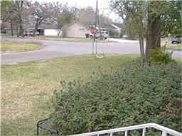 CORNER VIEW OF SUBDIVISION WITH TREE