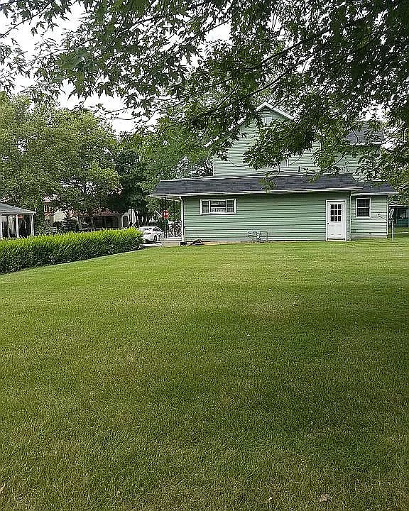 Kitchen window overlooks large backyard. Parking right outside your front door is available.