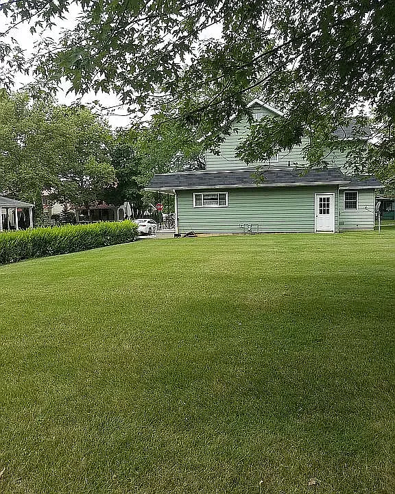 Kitchen window overlooks large backyard. Parking right outside your front door is available.