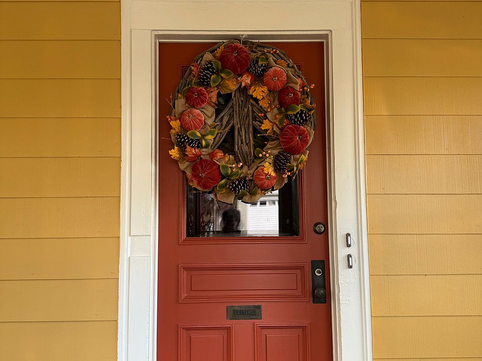 This front door entry door is located inside the front porch.
