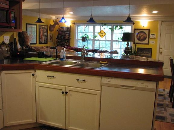 Kitchen looking into living room