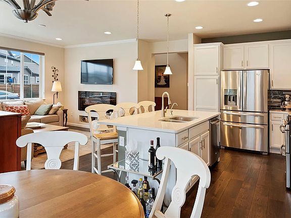 Open-concept kitchen, dining, and living space