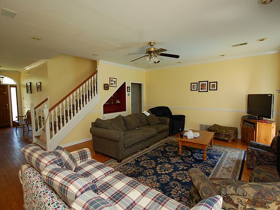 The living room has a great built in nook under the staircase.