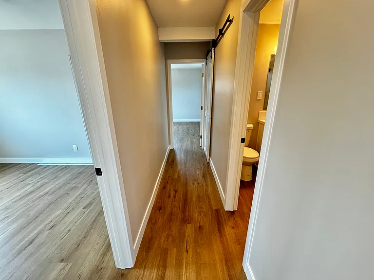 The Door way on the Left, Bedroom 2, Door way on the right Bathroom. Bedroom 1 end of the hallway.