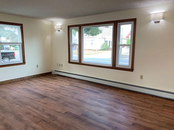 Living Room with large picture window and brand new flooring