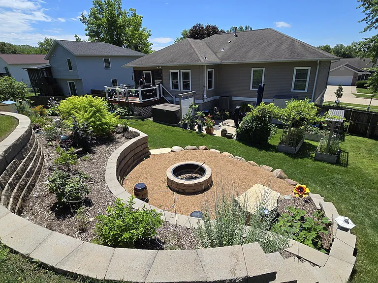 terraced backyard with built in firepit and fruit trees (cherry, nectarine, pawpaw) up top