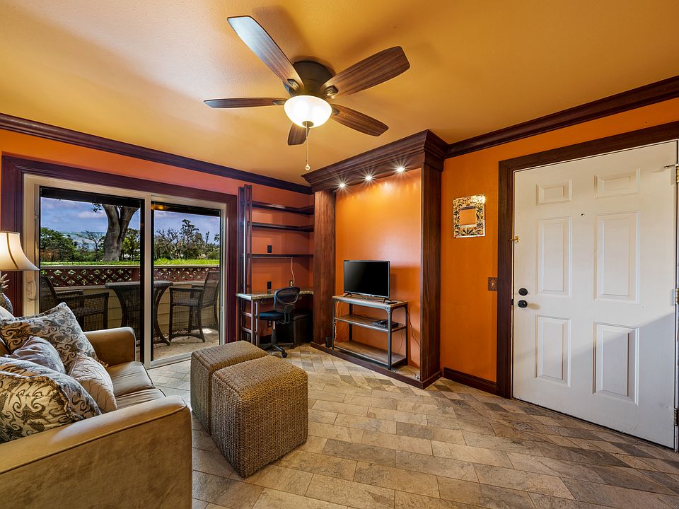 Living room view with built-in desk.