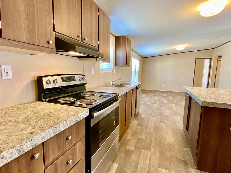 Kitchen, lots of cabinets stainless steel appliances.