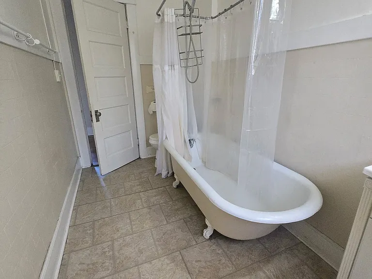 claw tub bath in historic building! Tall ceilings!
