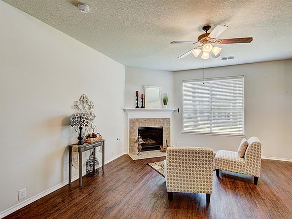 Spacious Living Room with a Fire Place to warm those cold nights.